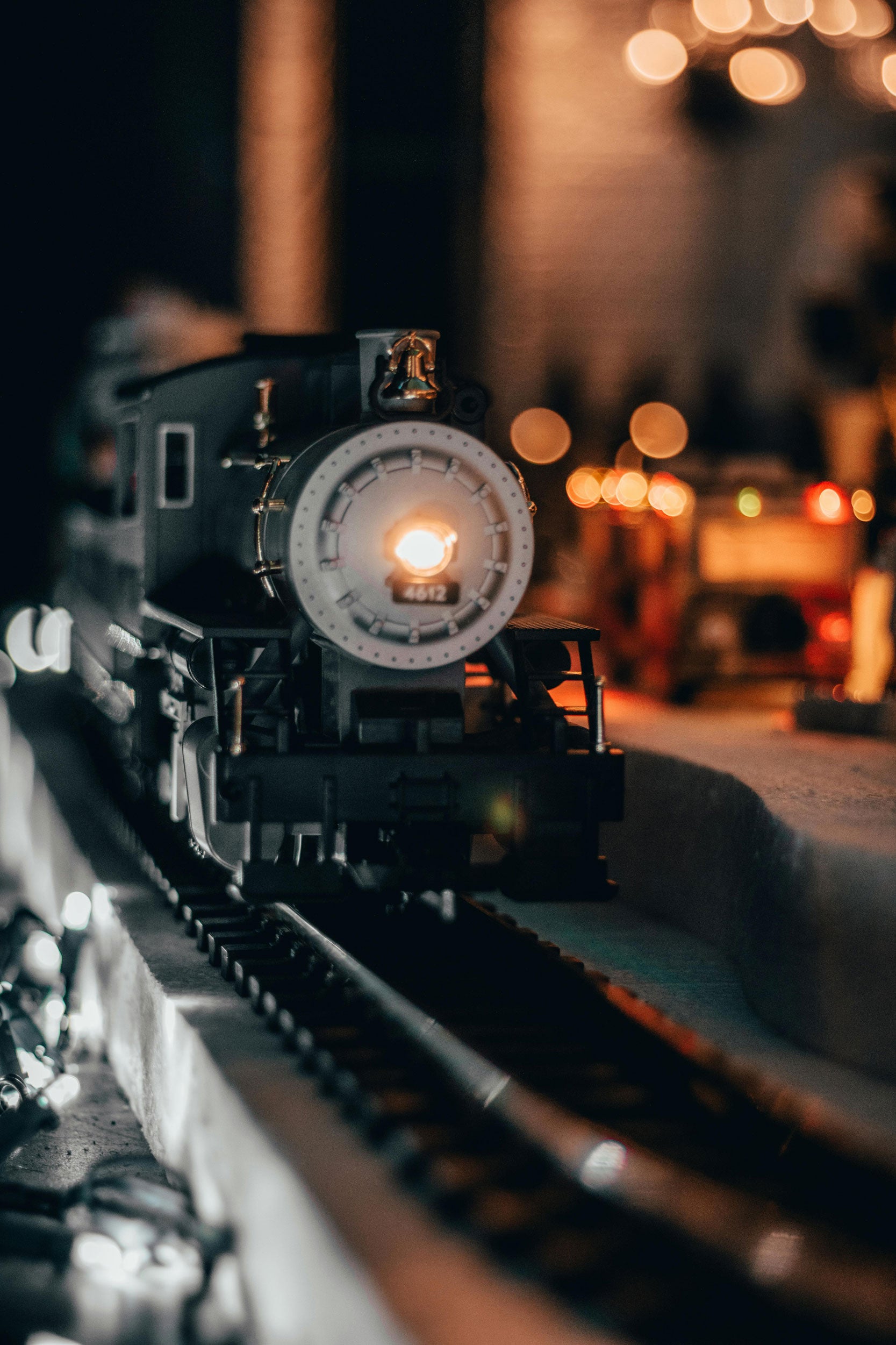 Model train on tracks with a blurred background
